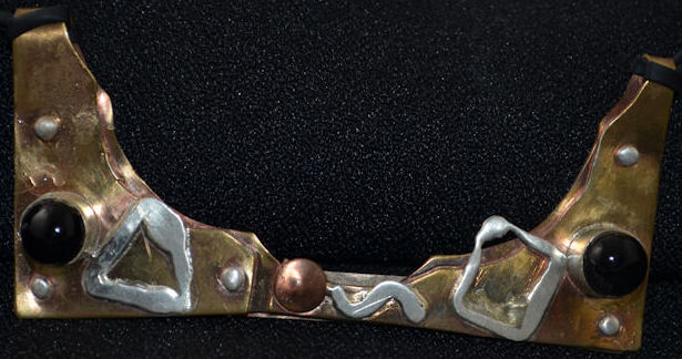 Folded metal pendant